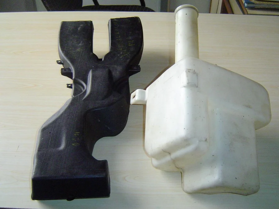 Blow moulded air duct and washer tank